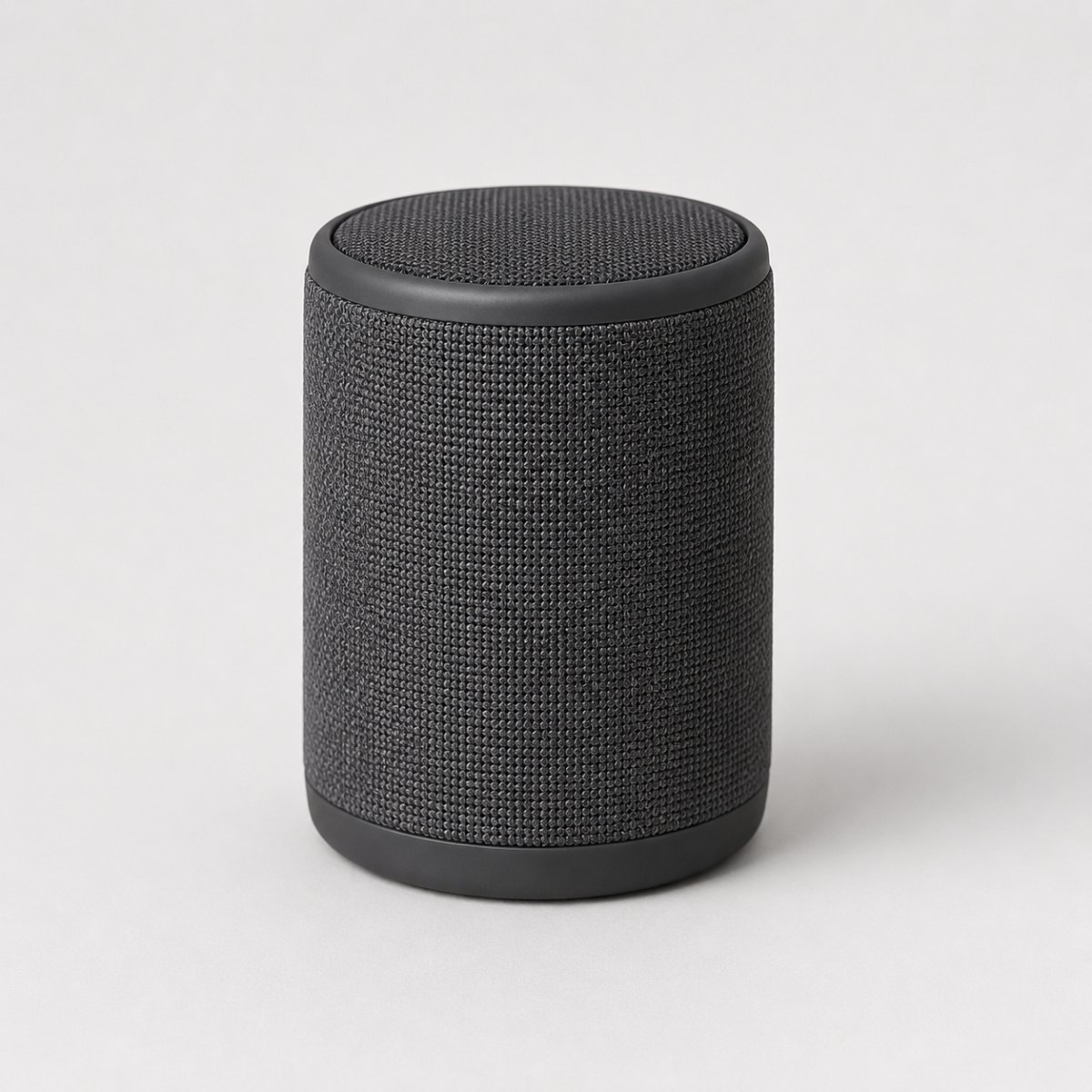 Koyu gri kumaş kaplı silindir bluetooth hoparlör